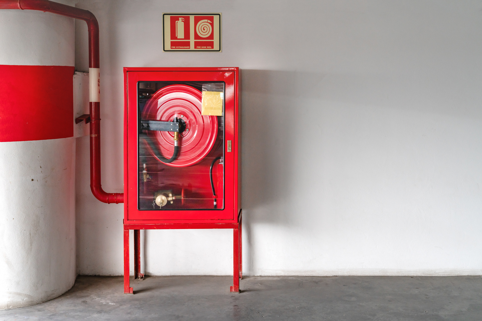 fire extinguish equipment with white wall